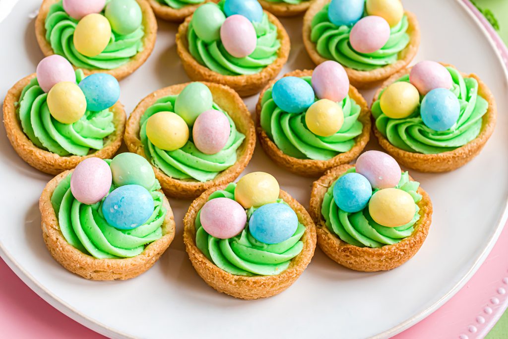 easter sugar cookie cups on a white plate