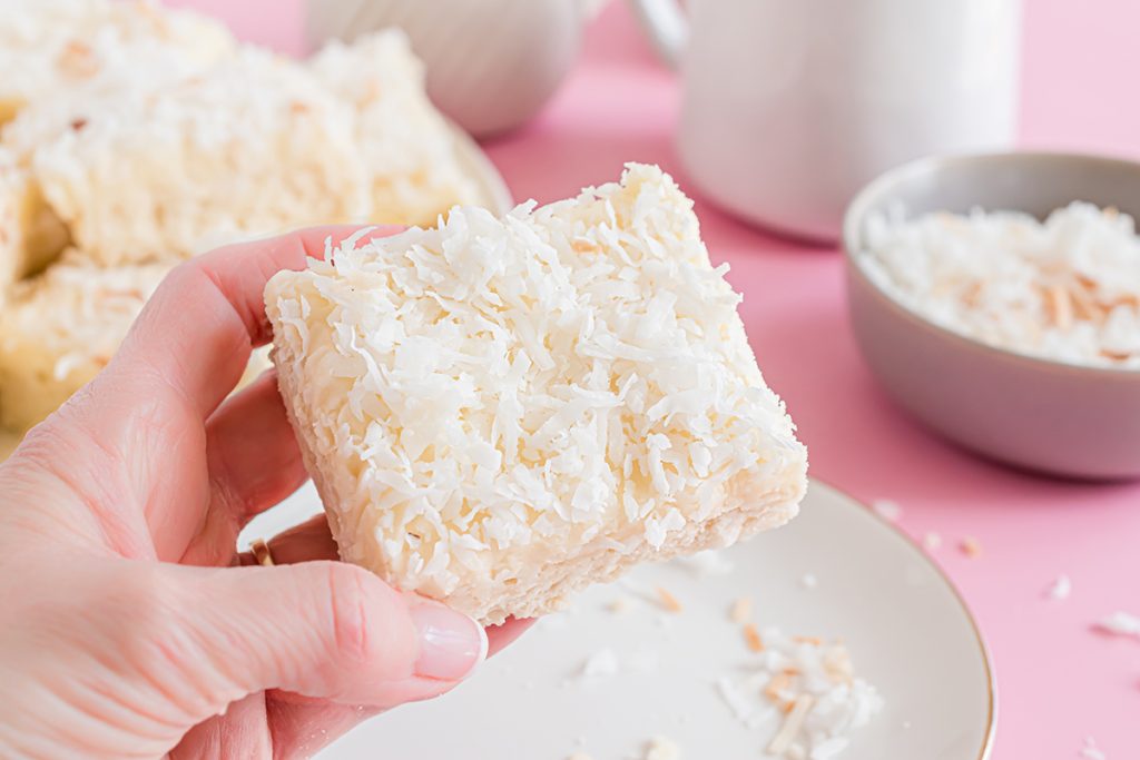 hand holding coconut cookie bar