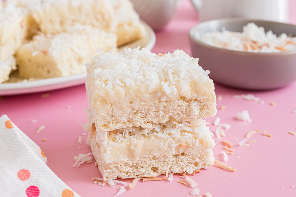 stack of frosted coconut bars