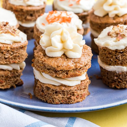 blue serving plate of individual carrot cakes