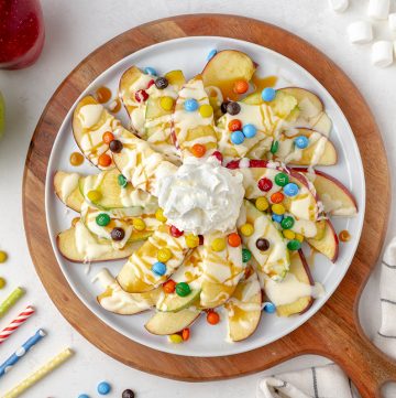 overhead of apple nachos with marshmallow and caramel sauce