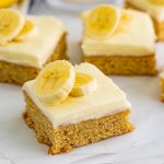 close up of banana blondies on parchment paper