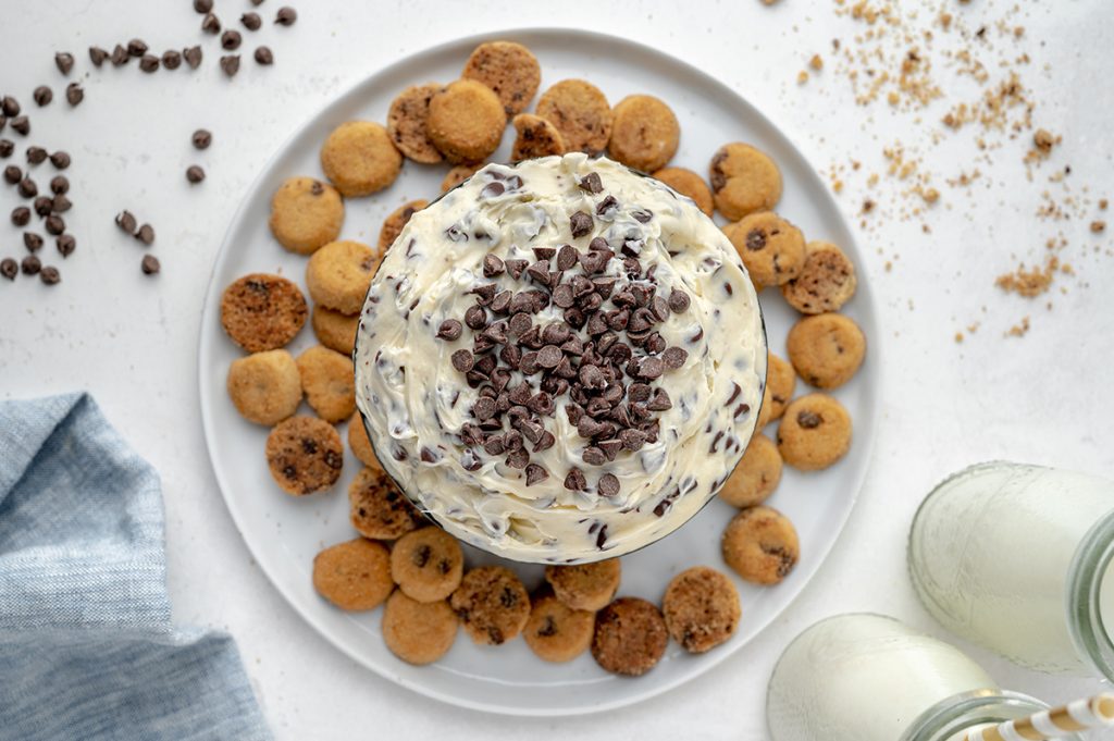 overhead of chocolate chip cookie dip with chocolate chip cookie dipper