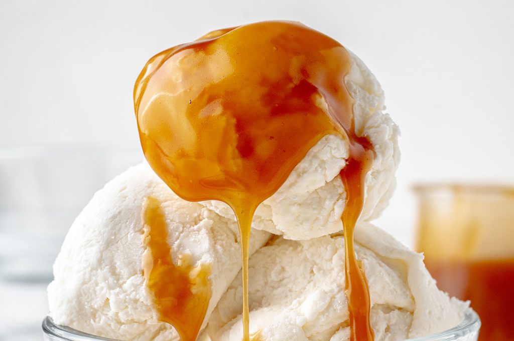 creamy caramel sauce dripping over ice cream