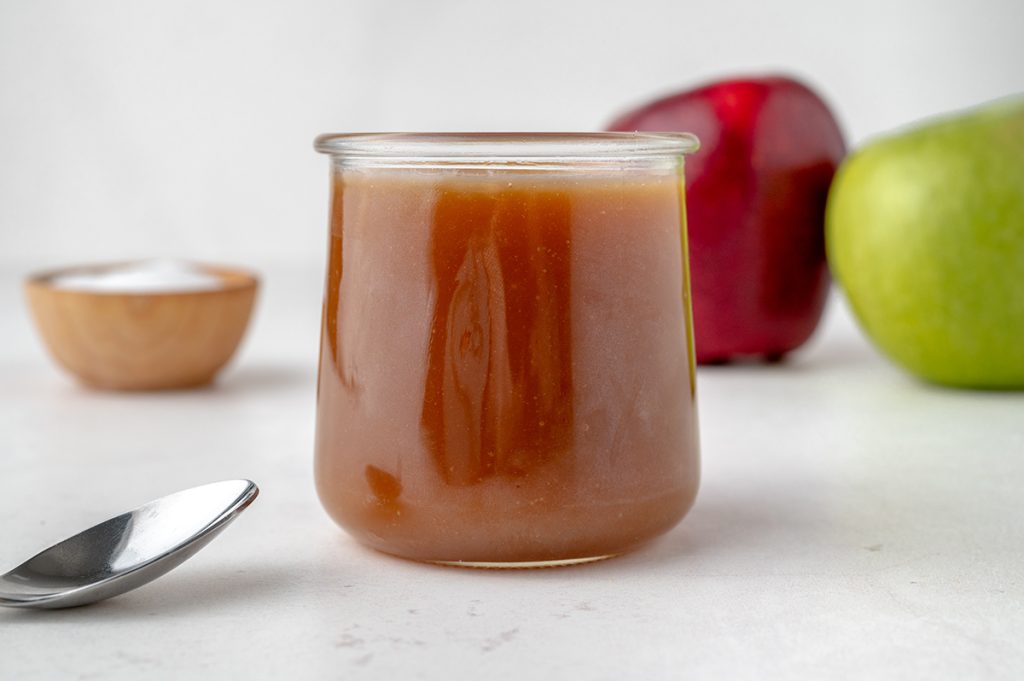 head-on view of caramel sauce in a glass container