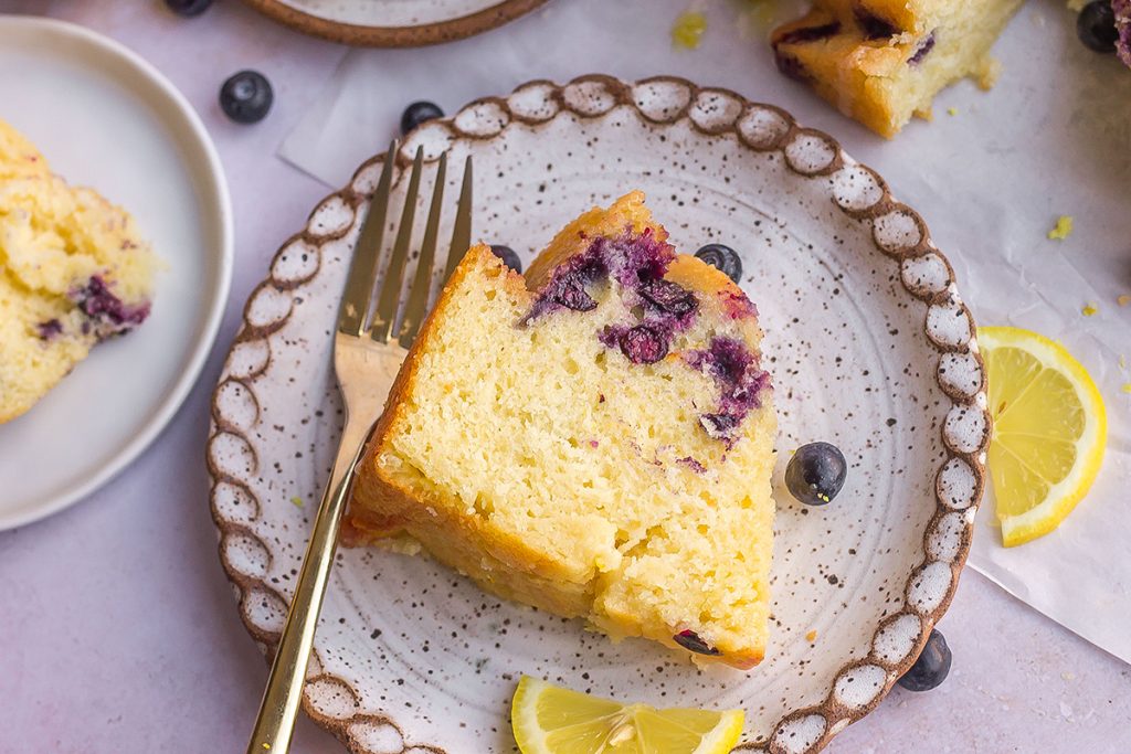slice of blueberry lemon cake on a plate