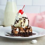 mississippi mud brownie topped with ice cream and whipped cream