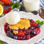 berry cobbler on a white serving plate
