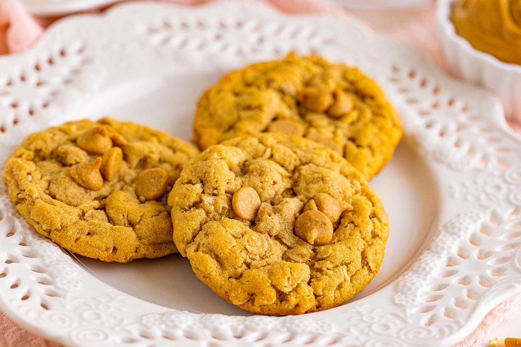 close up of peanut butter oatmeal cookies on a white plate