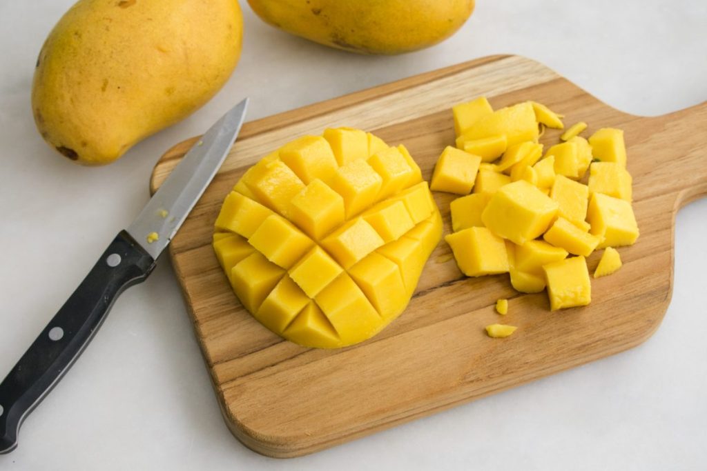 cut mango on a cutting board