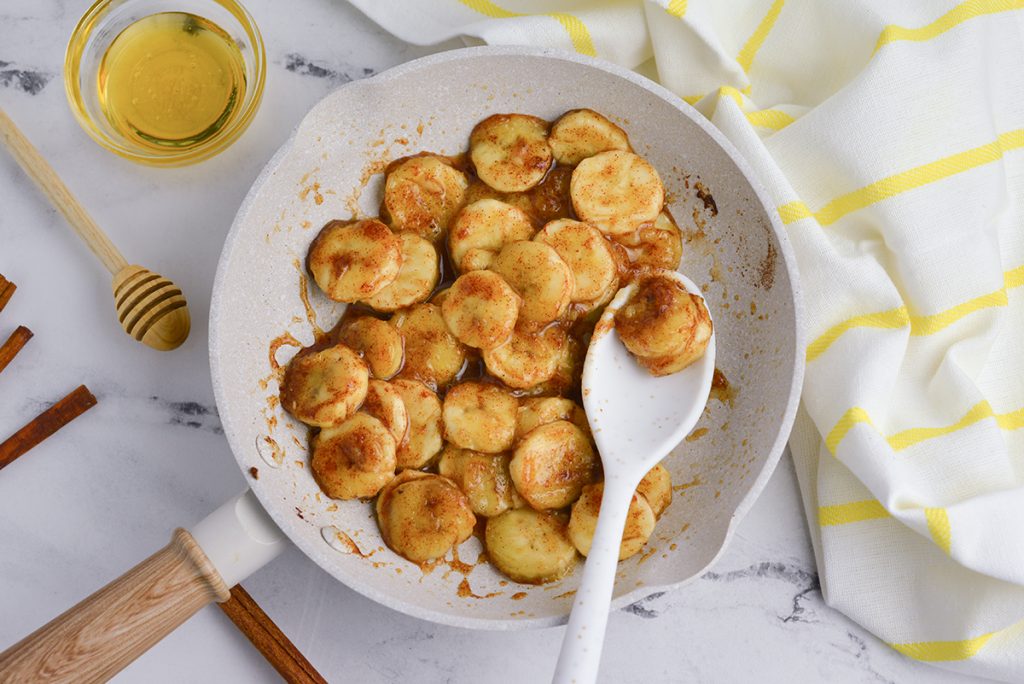 overhead shot of fried bananas in a pan