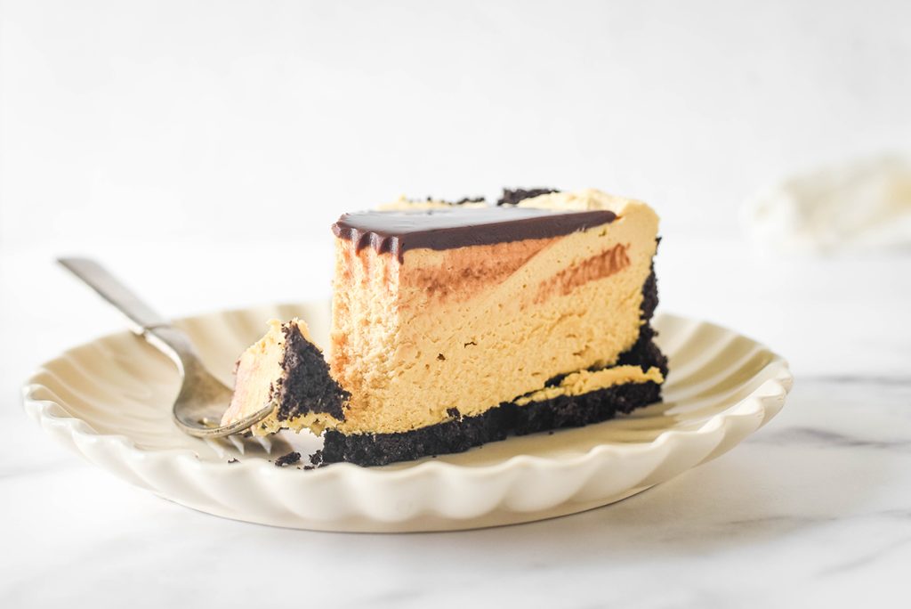 bite taken out of no bake peanut butter cheesecake slice