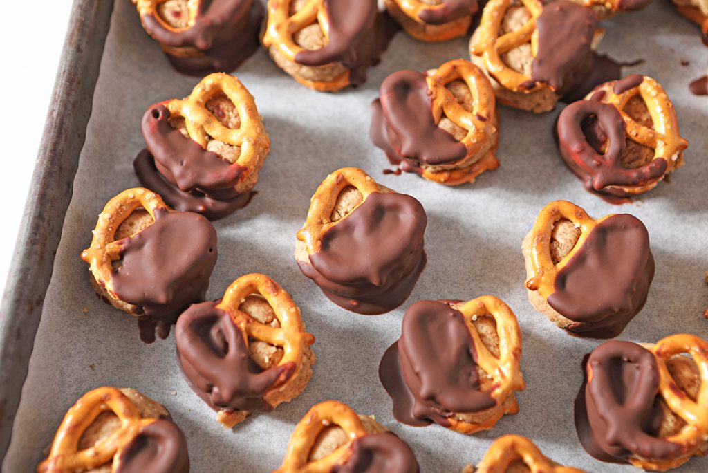 overhead shot of peanut butter pretzel bites on a sheet pan