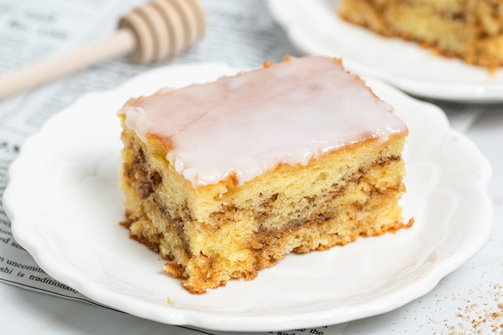 slice of honey bun cake on a plate