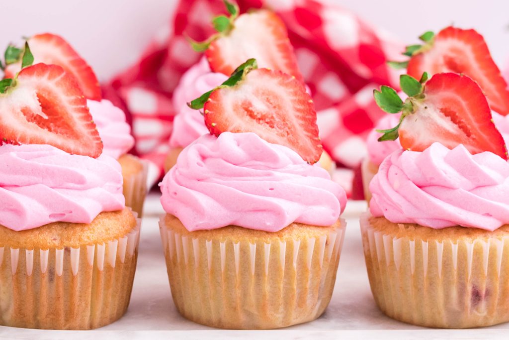 three lemon strawberry cupcakes