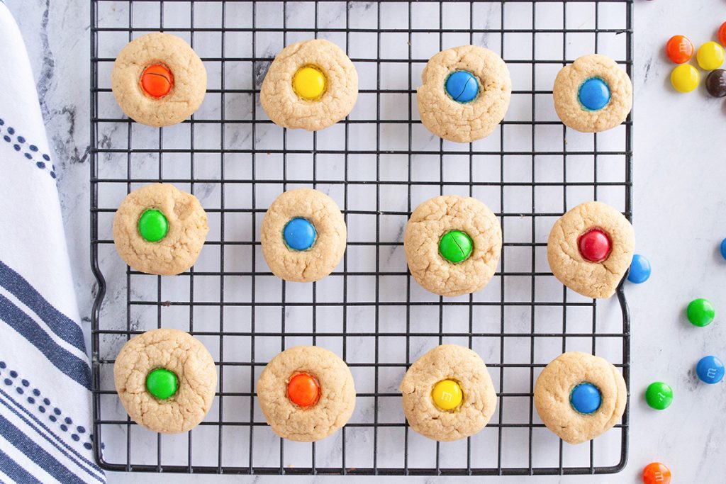m&m peanut butter blossom cookies on a cooling rack