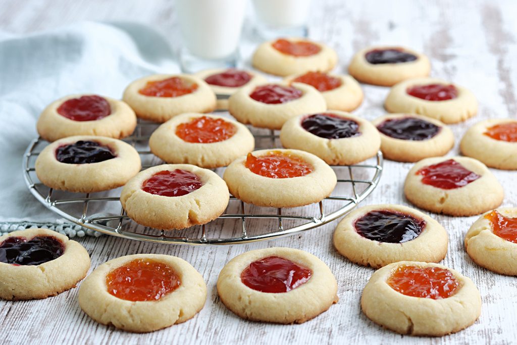 thumbprint cookies on a cooling rack