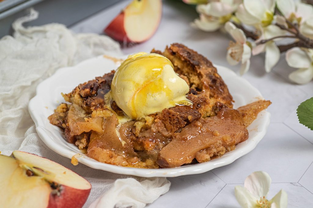 close up of caramel and ice cream on apple dump cake