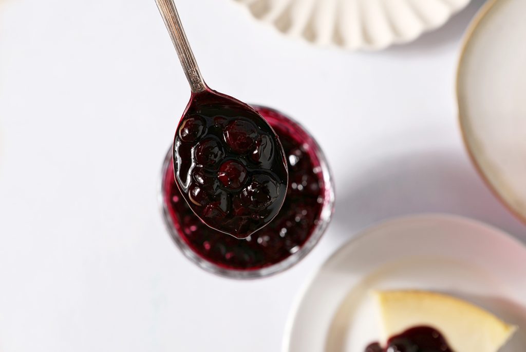 blueberry sauce on a spoon