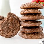 stack of brownie batter cookies with bite taken out of one