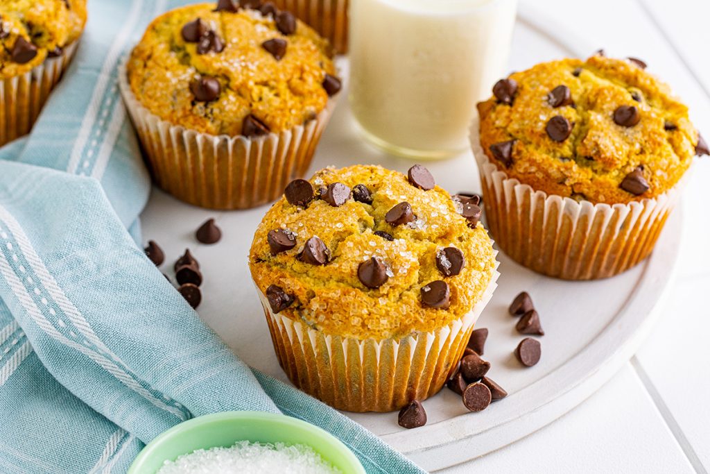 three chocolate chip muffins on a tray