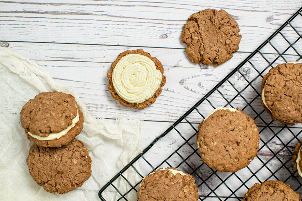 overhead shot of oatmeal cream pies on a cooling rack