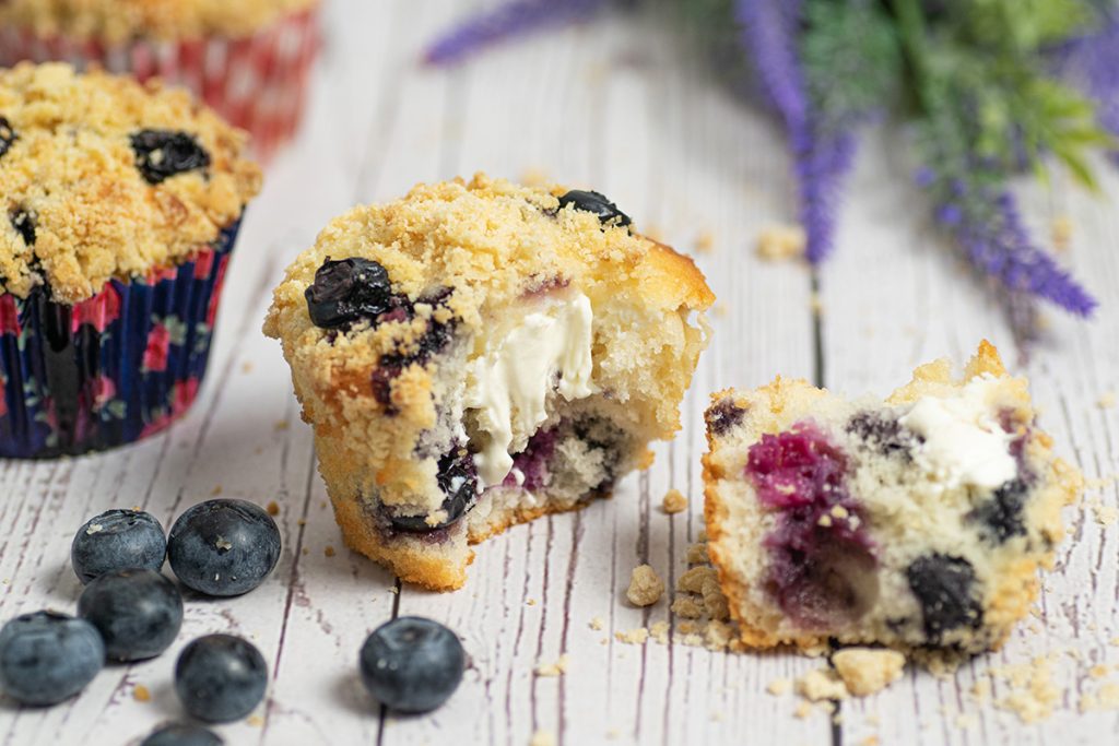 two halves of a blueberry cream cheese muffin