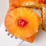 slice of pineapple upside down cake on spatula