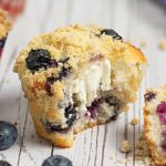 two halves of a blueberry cream cheese muffin