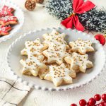 plate of white cut out cookies