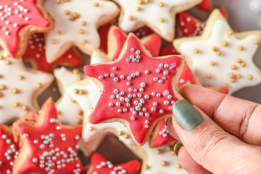 hand holding one star cookie
