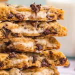 stack of broken in half cream cheese stuffed chocolate chip cookies