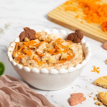 angled shot of carrot cake dip in a white bowl