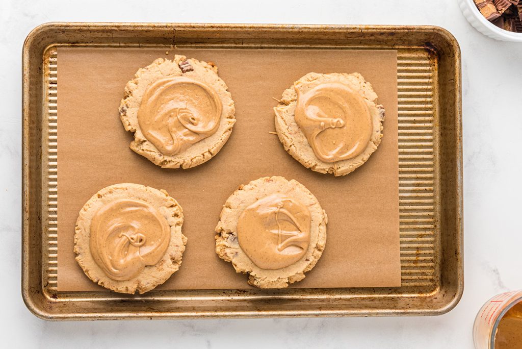 cookies topped with peanut butter frosting