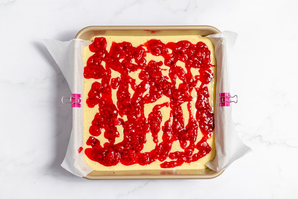 raspberry topping added to cheesecake batter