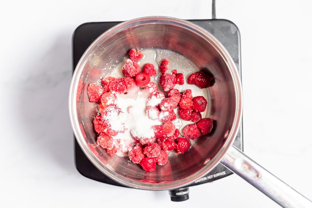 raspberries and sugar in a pan