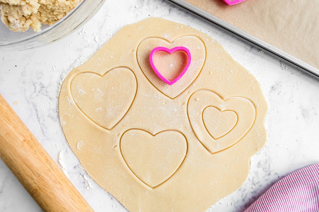 cookie cutter cutting cookie dough