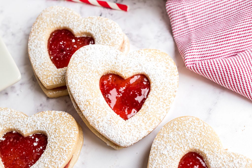 close up of two linzer cookies