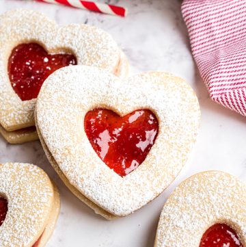 close up of two linzer cookies
