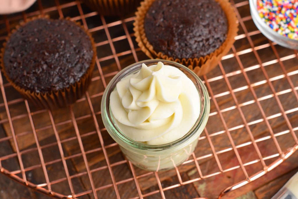 angled shot of jar of cream cheese frosting