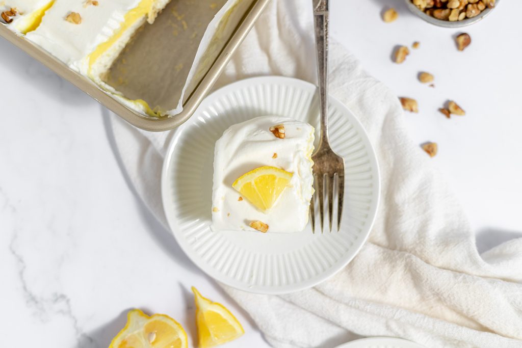 slice of lemon lush on plate with fork
