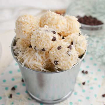 angled shot of bucket of no-bake coconut balls