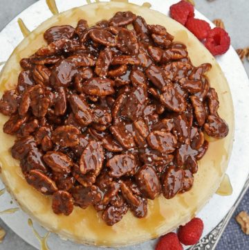 overhead shot of cheesecake topped with pecan pie filling
