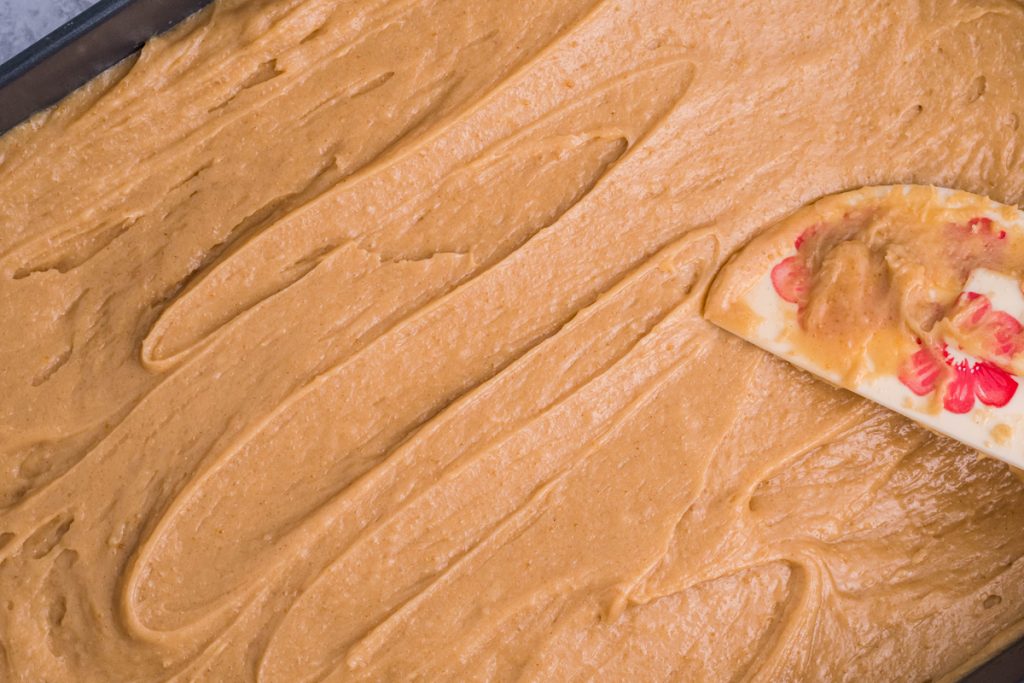 peanut butter sheet cake batter in pan